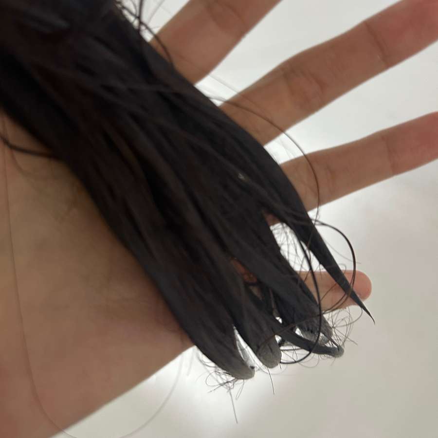 A verified Anuko customer showing their hair after using the Hair Butter
